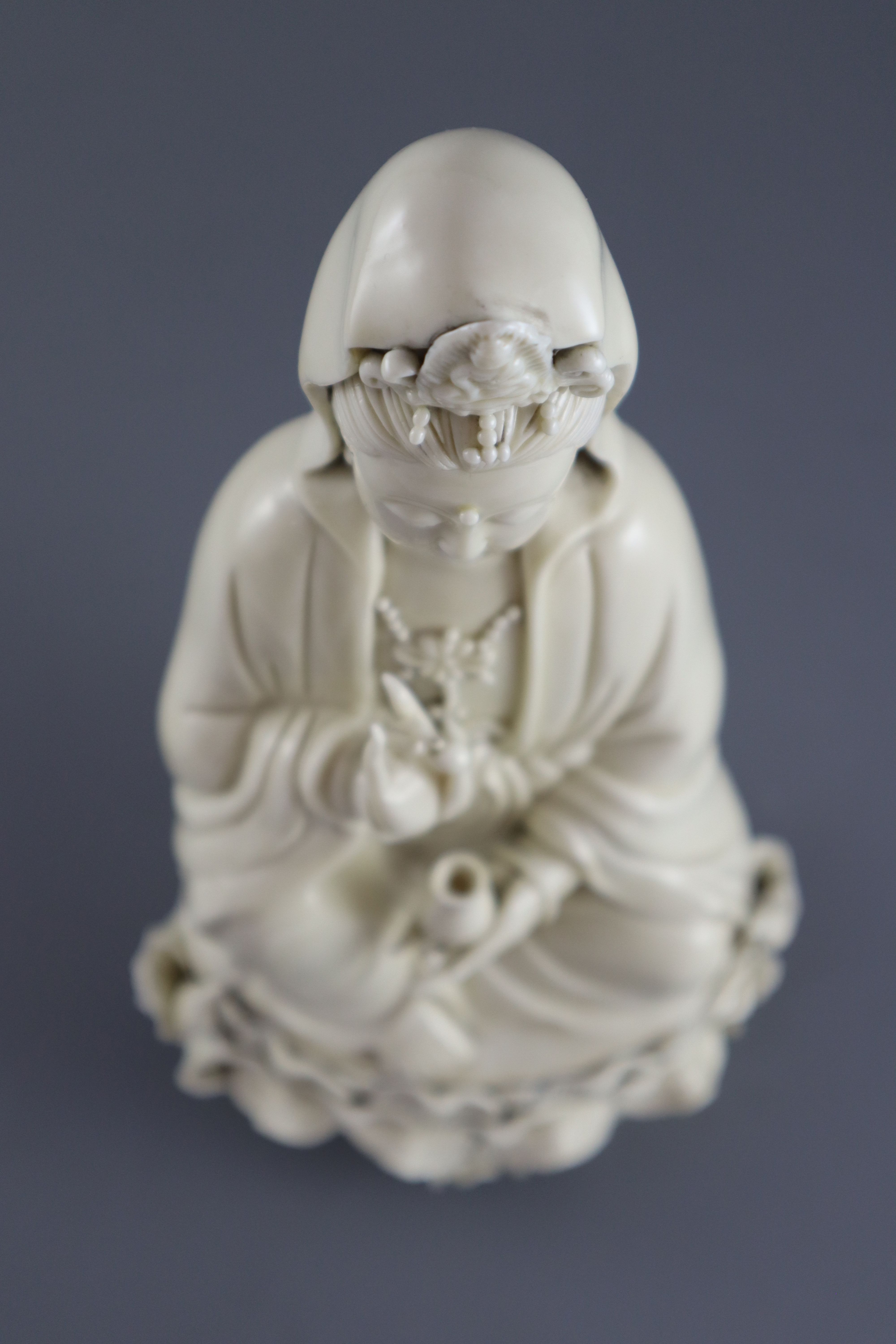 A Chinese Dehua blanc de chine figure of Guanyin, impressed seal to back, 26.5cm high